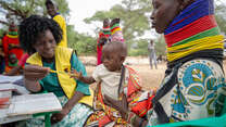 An IRC nurse attends to a child during an IRC community outreach program in Turkan, Kenya.